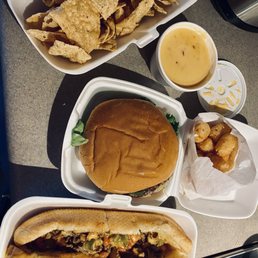 Chips and queso, bacon mushroom Swiss burger, tater tots, Flaming Philly cheesesteak