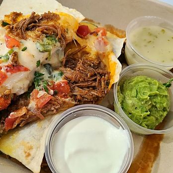 QDOBA Mexican Eats - Inside view of the create your own cheese crusted quesadilla - beef brisket birria - $12.79 - Mexican Near Me - Ocoee, Florida QDOBA Mexican Eats - Inside view of the create your own cheese crusted quesadilla - beef brisket birria - $12.79 - Mexican Near Me - Ocoee, Florida