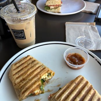 Corner Bakery Cafe - Avocado & Spinach Breakfast Wrap (V) and vanilla sweet cream cold brew, and Chicken Pesto sandwich - Sandwiches Near Me - Irvine, California Corner Bakery Cafe - Avocado & Spinach Breakfast Wrap (V) and vanilla sweet cream cold brew, and Chicken Pesto sandwich - Sandwiches Near Me - Irvine, California