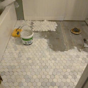 Floor & Decor - honed marble tile being installed in bathroom - Home Decor Near Me - Brookhaven, Georgia