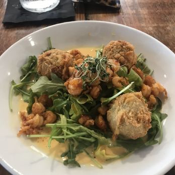 Spoke & Hub - Seafood-stuffed eggplant balls with fried crawfish tails (2/5) - Breakfast & Brunch Near Me - Baton Rouge, Louisiana
