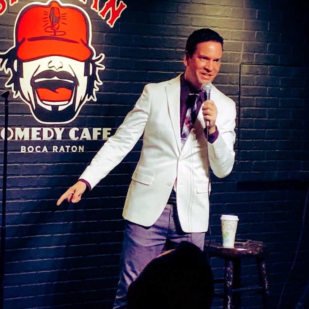 Sadman Comedy Cafe - a man in a suit and tie - Coffee & Tea Near Me - Boca Raton, Florida Sadman Comedy Cafe - a man in a suit and tie - Coffee & Tea Near Me - Boca Raton, Florida