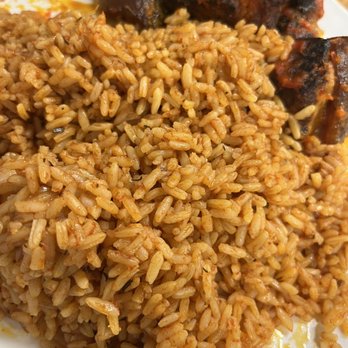 Olobe’s Kitchen - Jollof rice with stewed rice, one piece of meat missing, we were too excited to take a picture and ate first - African Near Me - Lavon, Texas