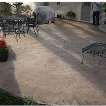 On The Spot Concrete - a patio with chairs and tables - Masonry/Concrete Near Me On The Spot Concrete - a patio with chairs and tables - Masonry/Concrete Near Me