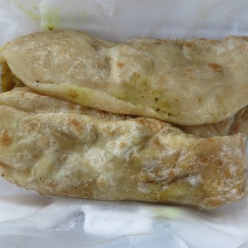 Singh's Roti Shop - chicken boneless roti $9.49 ($10.69 with tax) with 2 scoops of sides with the chicken 1/2017 - Trinidadian Near Me - Dorchester, Massachusetts