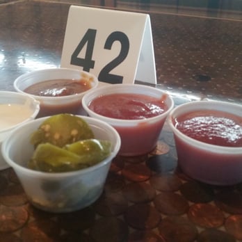 Serrano's Mexican Grill - Various salsa, jalapeños and sour cream from the salsa bar - Mexican Near Me - Anchorage, Alaska Serrano's Mexican Grill - Various salsa, jalapeños and sour cream from the salsa bar - Mexican Near Me - Anchorage, Alaska