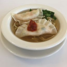 Shrimp dumplings in over a noodle broth. Shrimp dumplings in over a noodle broth.