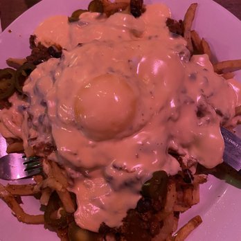 Poe's Tavern - Rue Morgue - bun-less chili cheese burger with a fried egg on a bed of fries! - Burgers Near Me - Atlantic Beach, Florida Poe's Tavern - Rue Morgue - bun-less chili cheese burger with a fried egg on a bed of fries! - Burgers Near Me - Atlantic Beach, Florida