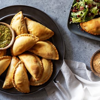 The Royal Pasty Co - a plate of empanadas and a bowl of salad - Empanadas Near Me - San Antonio, Texas The Royal Pasty Co - a plate of empanadas and a bowl of salad - Empanadas Near Me - San Antonio, Texas