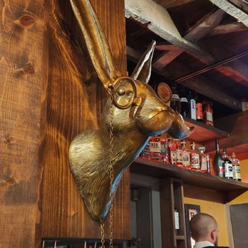 The High Dive - a deer head mounted on a wooden wall - Speakeasies Near Me - New Albany, Indiana