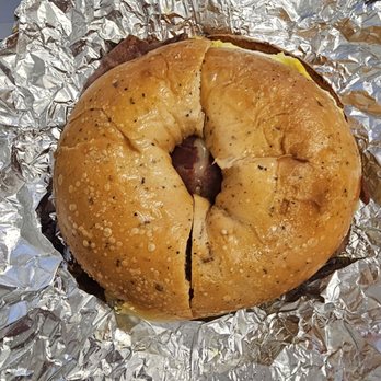 Tysons Bagel Market - Turkey bacon, egg, and mustard cheese on sun-dried tomato bagel - Bagels Near Me - Tysons Corner, Virginia Tysons Bagel Market - Turkey bacon, egg, and mustard cheese on sun-dried tomato bagel - Bagels Near Me - Tysons Corner, Virginia