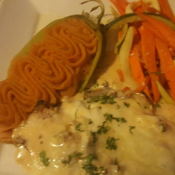 The Original Blue Adobe Grille - Chorizo stuffed chicken with a mushroom fontina cheese sauce on top, mashed green chili potatoes and veggies.. - Mexican Near Me - Mesa, Arizona