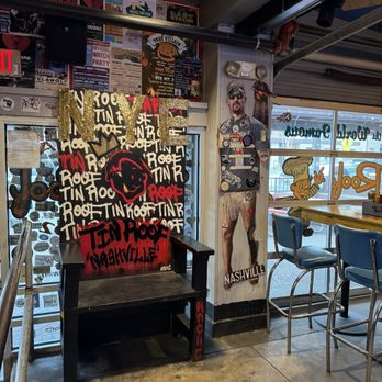 Tin Roof - the inside of a restaurant with a bench and tables - Bars Near Me - Nashville, Tennessee Tin Roof - the inside of a restaurant with a bench and tables - Bars Near Me - Nashville, Tennessee