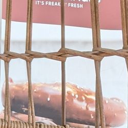 Das Brezel Haus - Banner sign as seen through the birdcage chair.