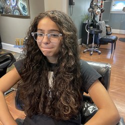 Chic Hair Designs - Subtle Highlights on curly hair.