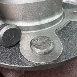 Ernie's Tire and Automotive - Damaged stud face compared to new stud.