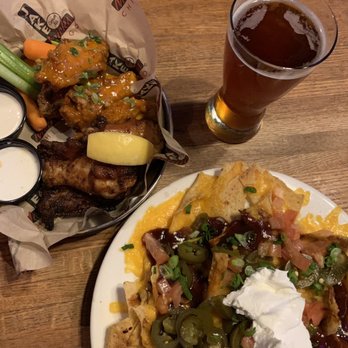 Jake Melnick's Corner Tap - Wings and pulled pork nachos - Sports Bars Near Me - Chicago, Illinois