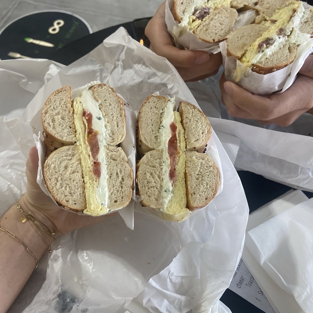Egg, tomato and scallion cream cheese on everything bagel and the 'salty babe' on a sesame bagel Egg, tomato and scallion cream cheese on everything bagel and the 'salty babe' on a sesame bagel