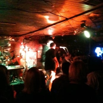 Ruby's Roadhouse - a band performing in a dimly lit room - Bars Near Me - Mandeville, Louisiana Ruby's Roadhouse - a band performing in a dimly lit room - Bars Near Me - Mandeville, Louisiana