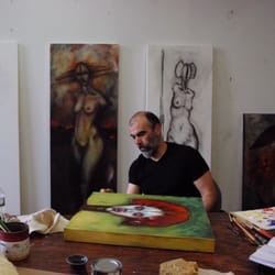Alés & Lores Studio - Roneld Lores finishing a painting.