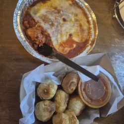 Michaelangelos Pizza & Subs - Lasagna and garlic knots with marinara sauce.