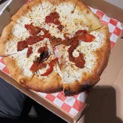 Napoli Stone-Fired Cuisine - Tomato skin pizza masquerading as margarita pizza. Where's the basil?