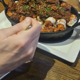 Tater tot appetizer with pulled pork. Tater tot appetizer with pulled pork.