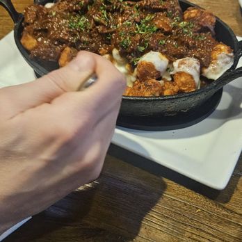 Midland Brew House - Tater tot appetizer with pulled pork. - Sports Bars Near Me - Saddle Brook, New Jersey Midland Brew House - Tater tot appetizer with pulled pork. - Sports Bars Near Me - Saddle Brook, New Jersey
