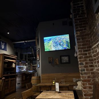 Skål Beer Hall - More seating with tv playing different landscapes. - Beer Bar Near Me - Seattle, Washington Skål Beer Hall - More seating with tv playing different landscapes. - Beer Bar Near Me - Seattle, Washington