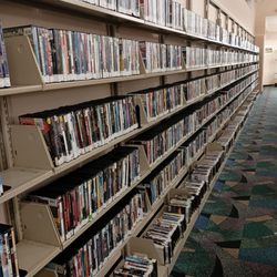Broward County Libraries - Deerfield Beach Percy White Branch - Long wall of DVDs