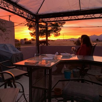 Xanadu Ranch GetAway - a woman sitting at a table - Bed & Breakfast Near Me - Sonoita, Arizona Xanadu Ranch GetAway - a woman sitting at a table - Bed & Breakfast Near Me - Sonoita, Arizona