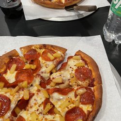 Master Pizza - My favorite pizza pepperoni and pineapple. My husband's favorite pizza sausage with extra cheese.