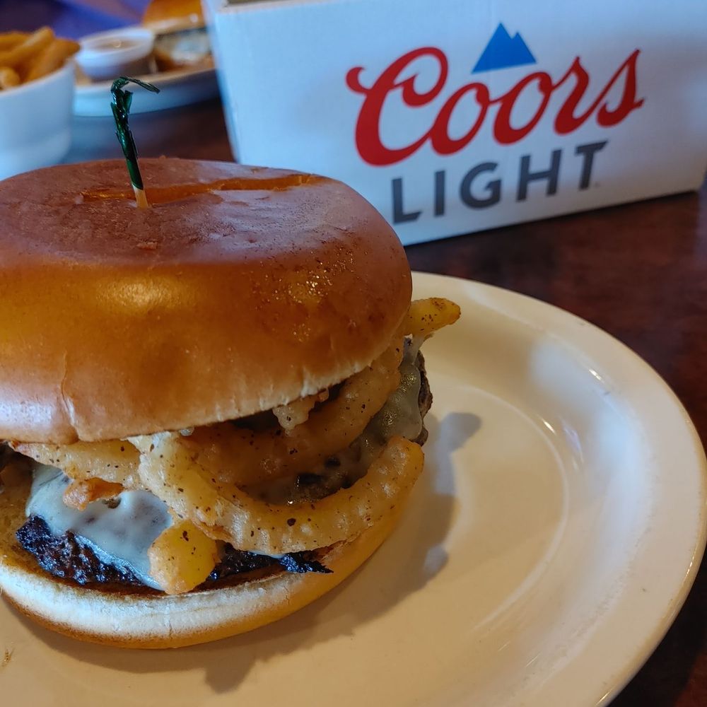 Champions Grille - burger with onion straws - Beer, Wine & Spirits Near Me - Cincinnati, Ohio