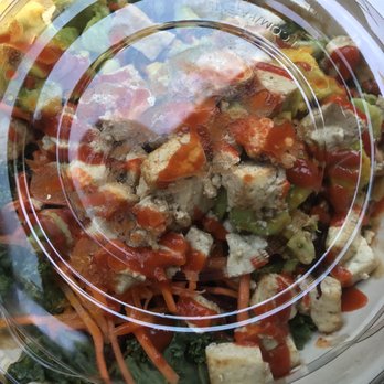 CoreLife Eatery - Sriracha Ginger Tofu & Quinoa with the lid - New American Near Me - Portage, Michigan
