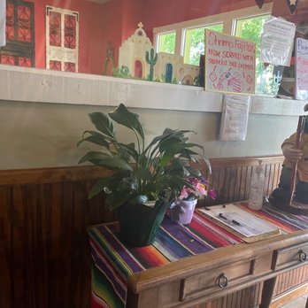 Garcias Restaurant - a table with a potted plant - Mexican Near Me - Buda, Texas Garcias Restaurant - a table with a potted plant - Mexican Near Me - Buda, Texas