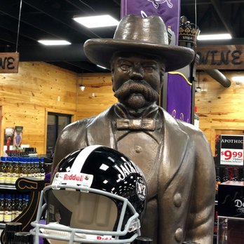 Hilltop Liquor Store - a statue of a man holding a football helmet - Beer, Wine & Spirits Near Me - Macon, Georgia Hilltop Liquor Store - a statue of a man holding a football helmet - Beer, Wine & Spirits Near Me - Macon, Georgia