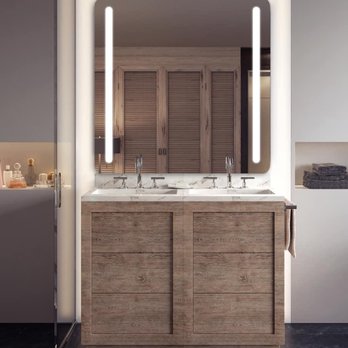JB Construction - a bathroom with a vanity and mirror - General Contractors Near Me - Lancaster, California JB Construction - a bathroom with a vanity and mirror - General Contractors Near Me - Lancaster, California