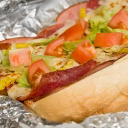 Crossroads Pizza - Italian sub made with ham, salami, pepperoni, onion, banana pepper, lettuce, tomato and love