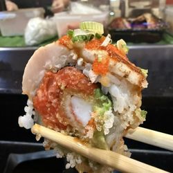 Kobe Hibachi Sushi Asian Cuisine - Crazy Roll $17 Spicy tuna, shrimp tempura, avocado, cucumber, topped with white tuna, yellowtail, tobiko