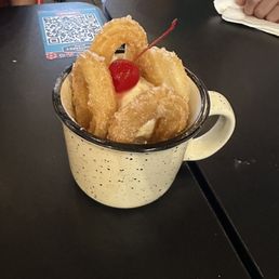 Cup of churros and ice cream. Cup of churros and ice cream.