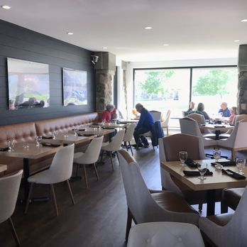 Red Rock Trattoria - a dining area with tables and chairs - Italian Near Me - Waterton, Alberta Red Rock Trattoria - a dining area with tables and chairs - Italian Near Me - Waterton, Alberta