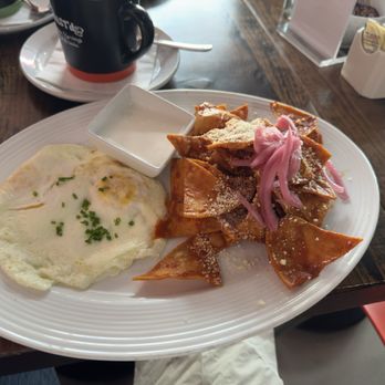 Toast’d In PS - Chilaquiles with crema and over-easy eggs. Coffee, black and strong. - Coffee & Tea Near Me - Palm Springs, California Toast’d In PS - Chilaquiles with crema and over-easy eggs. Coffee, black and strong. - Coffee & Tea Near Me - Palm Springs, California