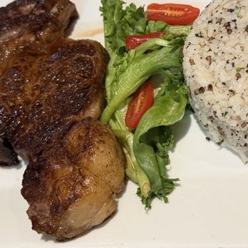 Chicharrón - Ribeye with arroz blanco con morcilla - Puerto Rican Near Me - San Juan, Puerto Rico