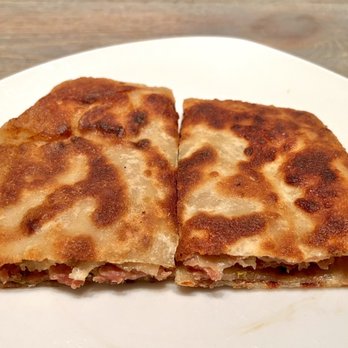 Major Dumplings - Peking Meat Pie. Pork sandwiched between a thin pancake and fried. It seemed a little too fried for me, but the pork is good. - Asian Fusion Near Me - Diamond Bar, California Major Dumplings - Peking Meat Pie. Pork sandwiched between a thin pancake and fried. It seemed a little too fried for me, but the pork is good. - Asian Fusion Near Me - Diamond Bar, California