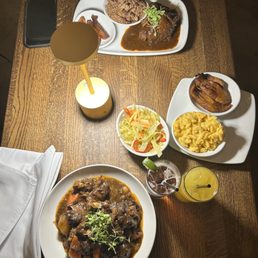 Oxtails entree and JERK RIB TIPS Mac & Cheese Fried Plantains