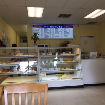 Westco Donuts - Not sure if you can read the menu.  I was trying to be discreet. Customers waiting on the sidelines. - Donuts Near Me - Kingwood, Texas