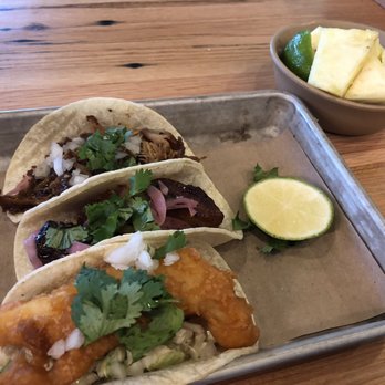 Bartaco - Starting from the back: roasted duck, glazed pork belly, and Baja fish. Then a side of fresh pineapple. - Tacos Near Me - Raleigh, North Carolina