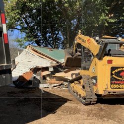Peninsula Demolition - Cleaning up a pile of trash