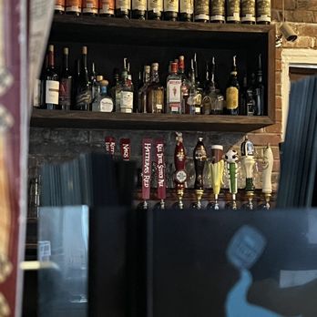 Lost Colony Tavern - bottles of alcohol on shelves - Pubs Near Me - Manteo, North Carolina