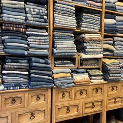 Los Baules Remigío - Indigo wall of shawls and ponchos.